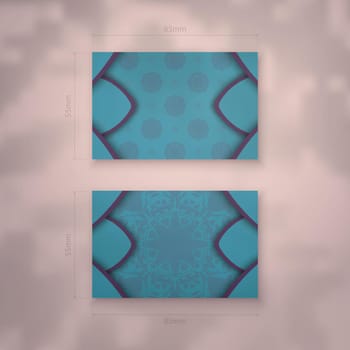 Business card in turquoise color with Indian purple ornaments for your business.