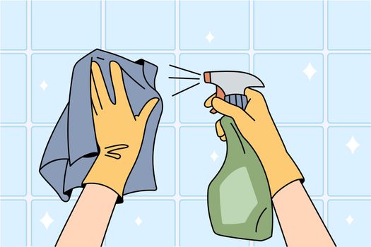 Housekeeper in gloves and napkin clean surface with spray detergent clear house. Person wipe tiles with chemical liquid. Hygiene and household concept. Flat vector illustration, cartoon character.