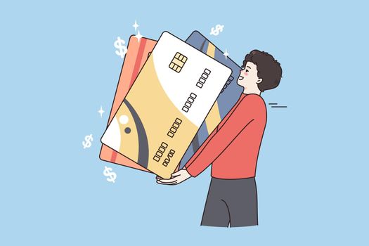 Financial success and wealth concept. Young positive man holding huge credit cards for paying feeling excited over blue background vector illustration