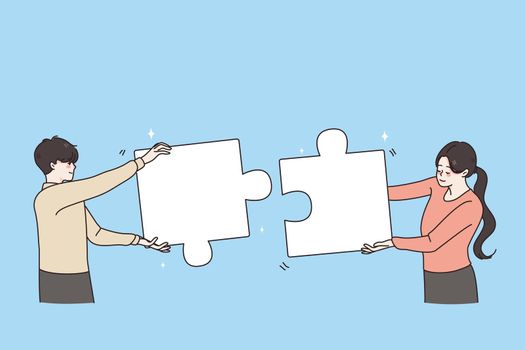 Teamwork, success and collaboration concept. Young man and woman coworkers standing uniting pieces of one puzzle together vector illustration
