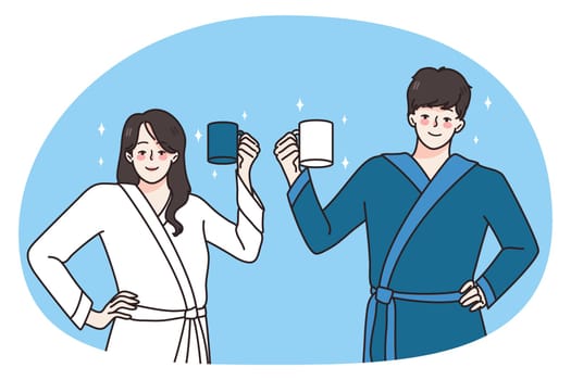 Happy young couple in bathrobes hold mugs drinking coffee in morning welcome new day. Smiling man and woman with cups have breakfast at home together. Habit concept. Vector illustration.