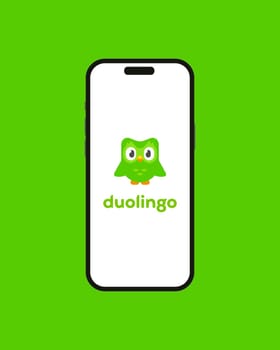 Kyiv, Ukraine - 03 June 2022: Owl Duolingo logo on Iphone 14 screen - vector illustration. Duolingo an American educational technology company. App on the smartphone for learning foreign languages
