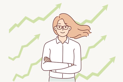 Successful businesswoman stands with arms crossed near arrow-graphs pointing up. Successful woman manager is proud of business achievements and increasing company profits due to ambitious lifestyle