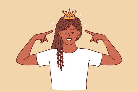 Woman princess in golden crown winks and smiles, proud of diadem won in competition. African American young girl with crown symbolizing monarchical status and superiority over others