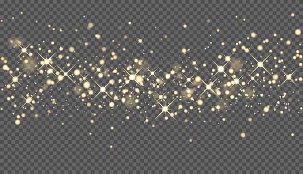 Glowing gold sparkles. The glitter of golden dust in the rays of light. Abstract festive background.