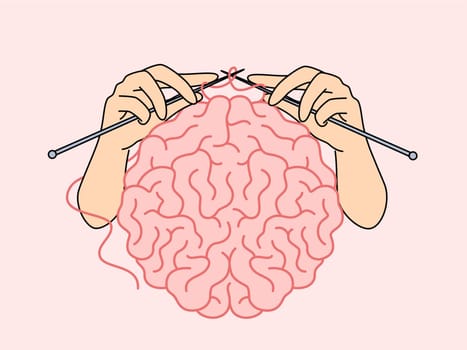 Human brain and hands with knitting needles, as metaphor for intellectual development and attempts to become smarter. Concept self-development and increasing brain capabilities to achieve your goals