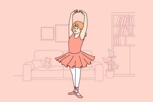 Little ballerina dreams of ballet, and practices dancing, standing in apartment, dressed in dress and pointe shoes. Girl ballerina stands on toes, demonstrating grace that comes from regular training.