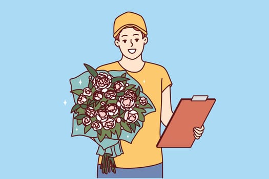 Man courier with bouquet of flowers and clipboard holds roses to screen while presenting gift. Guy from flower delivery service gives gift bouquet for birthday or relationship anniversary