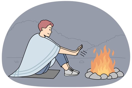 Young man sit on ground in nature warm hands at campfire at night. Smiling male relax on hiking trip in forest near fire. Vector illustration.