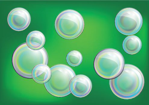 multicolored soap bubble on green summer background