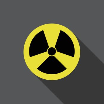 Flat round icon of nuclear danger on grey background