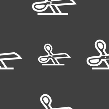scissors icon sign. Seamless pattern on a gray background. Vector illustration