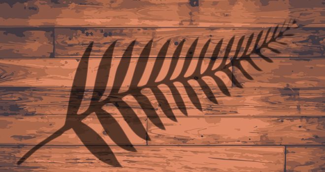 New Zealand fern brandeded onto wooden planks