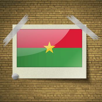 Flags of Burkia Faso at frame on a brick background. Vector illustration