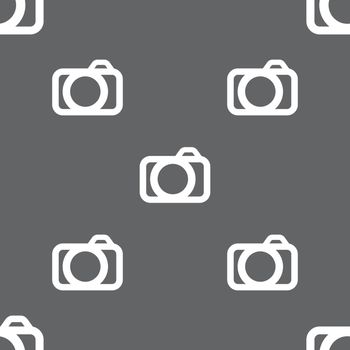 Photo camera sign icon. Digital photo camera symbol. Seamless pattern on a gray background. Vector illustration