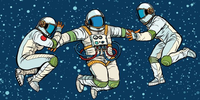 three astronauts in space in zero gravity. Pop art retro vector illustration kitsch vintage