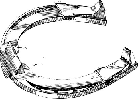 This illustration represents Shoe With Removable Calks which is screwed into the bottom of a horse shoe vintage line drawing or engraving illustration.