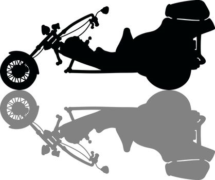 The black silhouette of a heavy motor tricycle