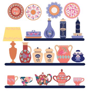 Collection of beautifully ceramic and porcelain household utensils and tools. Kitchen tableware on shelves. Decorative ceramic utensils and crockery plates, cups, dishes, bowls and pitcher.