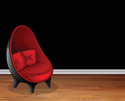 Red chair in front of black wall