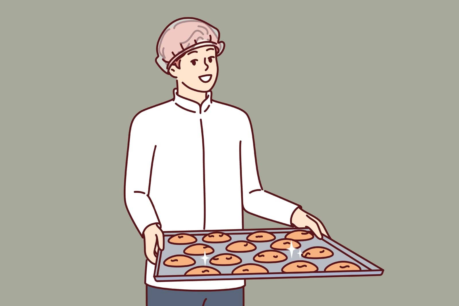 Man pastry chef is holding tray of cookies, dressed in white chef shirt and disposable hair cap. Guy confectioner prepares oatmeal cookies from natural ingredients, for sale in own bakery