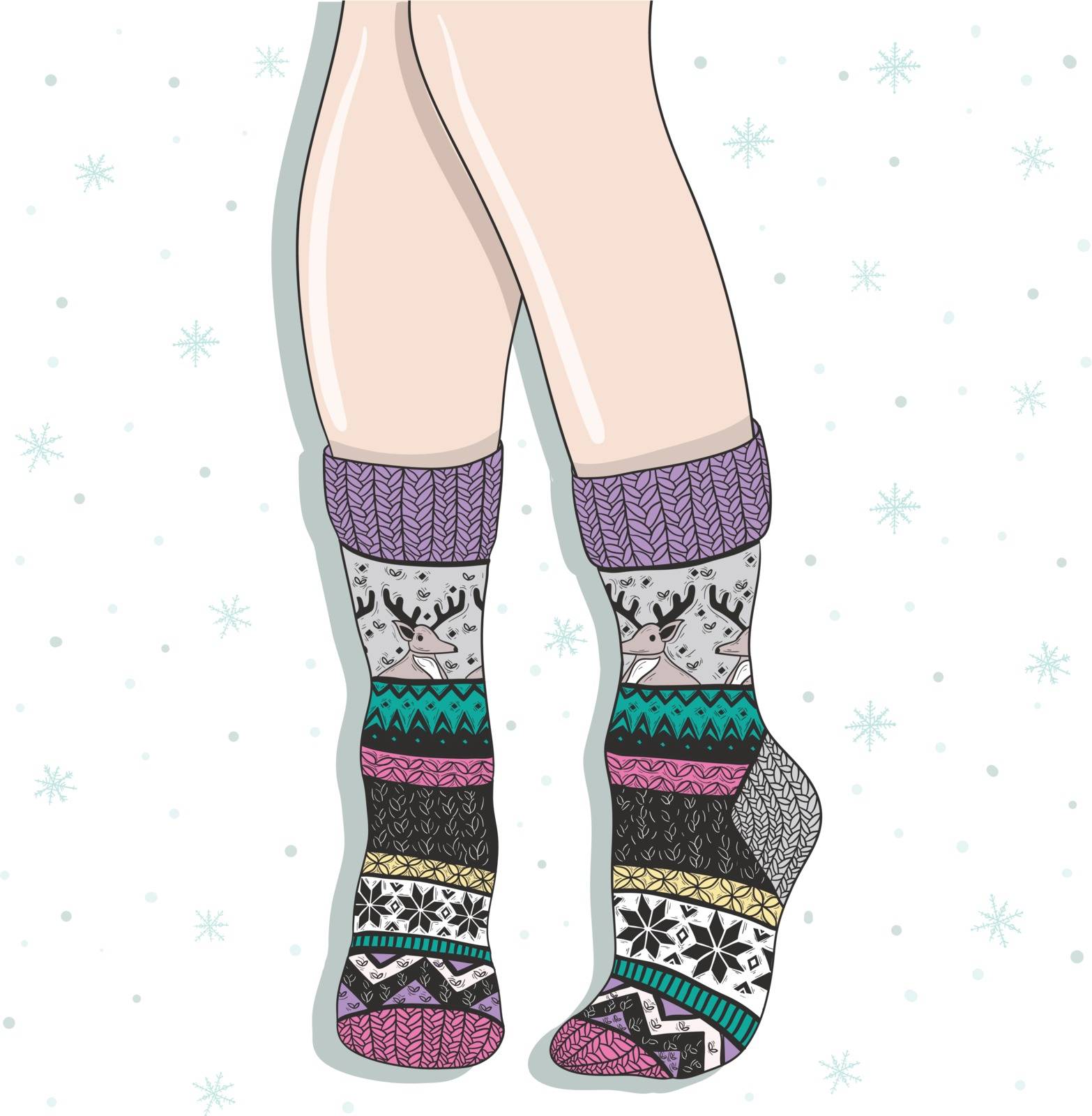 Woman wearing a pair of wool socks. Cute winter background. by lapesnape