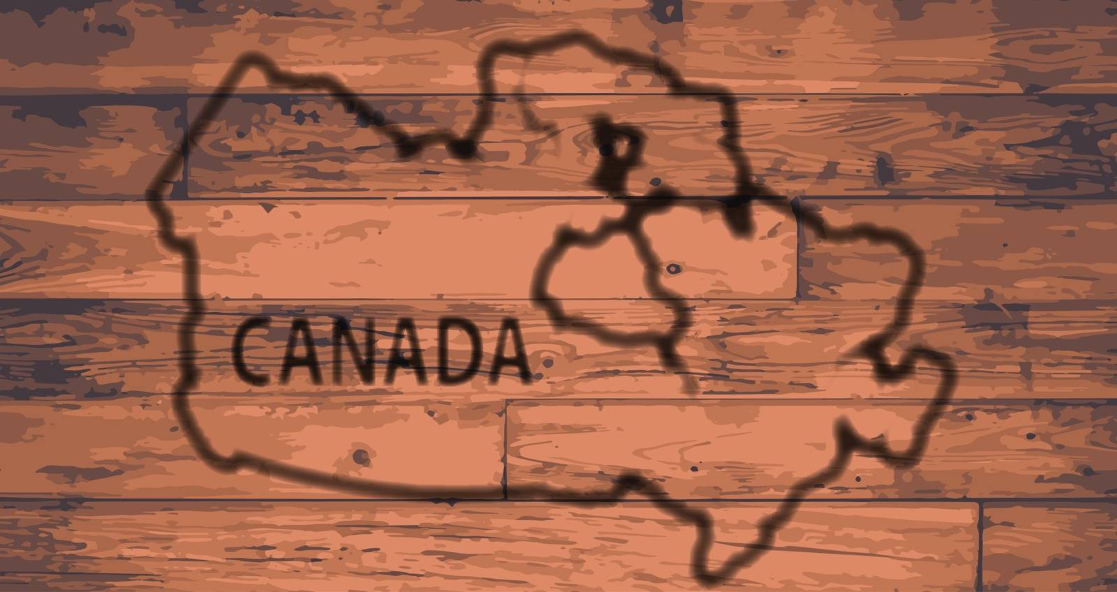 Canada map outline brand on wooden board